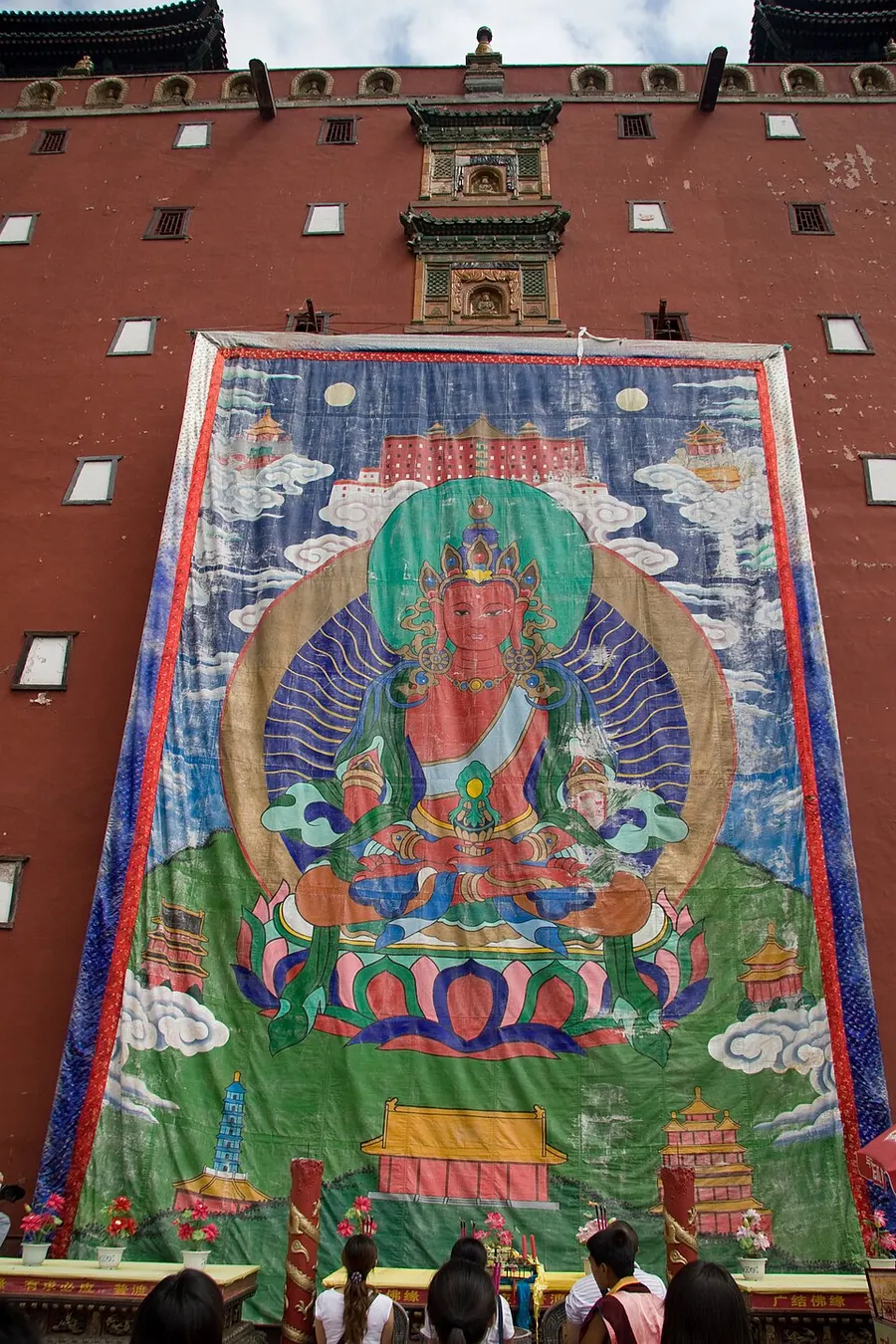 Regong thangka painting with intricate Buddhist iconography