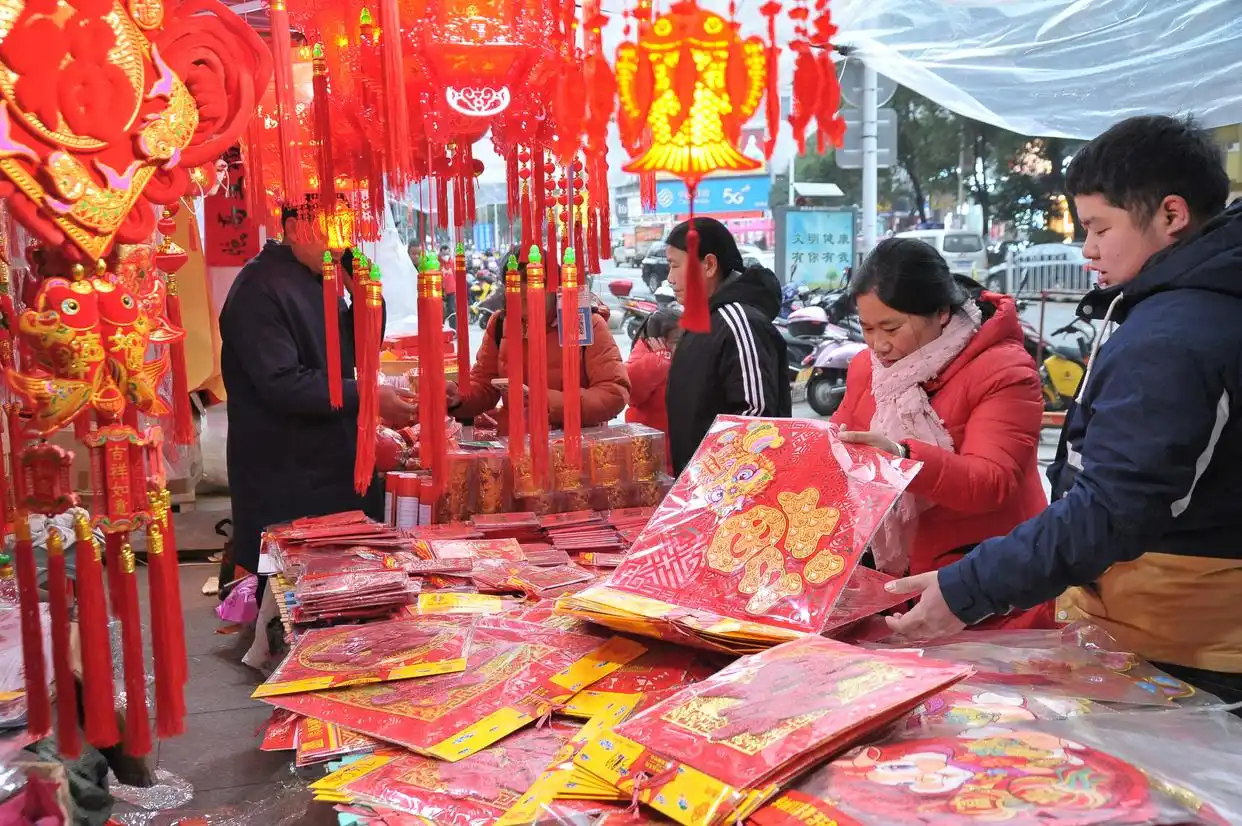 Shoppers buying spring couplets and red lanterns for the new year