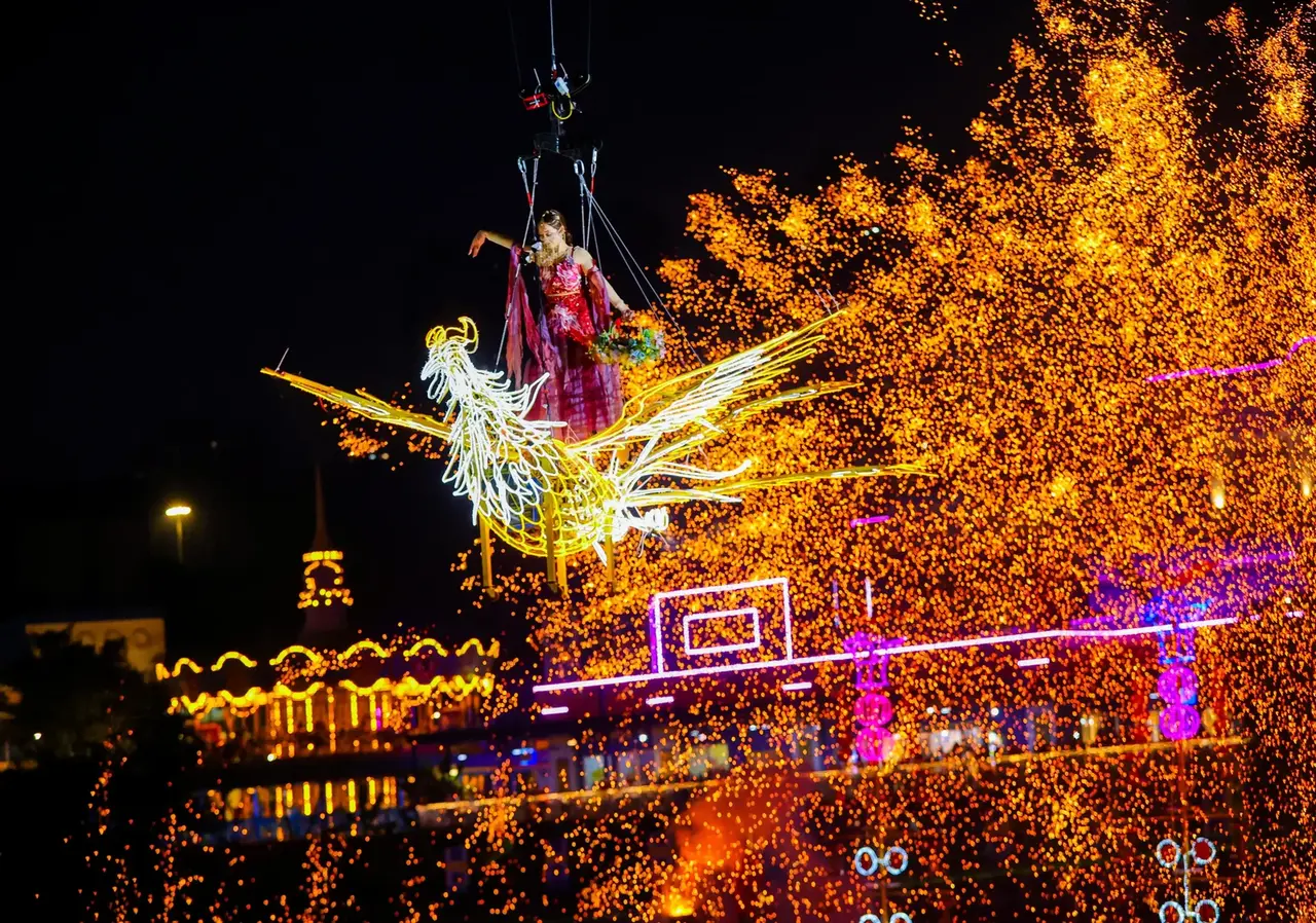 A woman in classical dress performing during the fireworks show