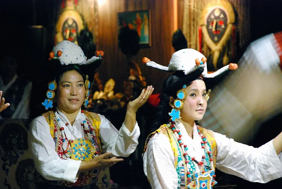 Tibetan Opera performer in traditional mask and costume